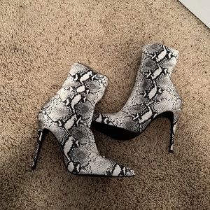 Women’s heeled booties. Never worn